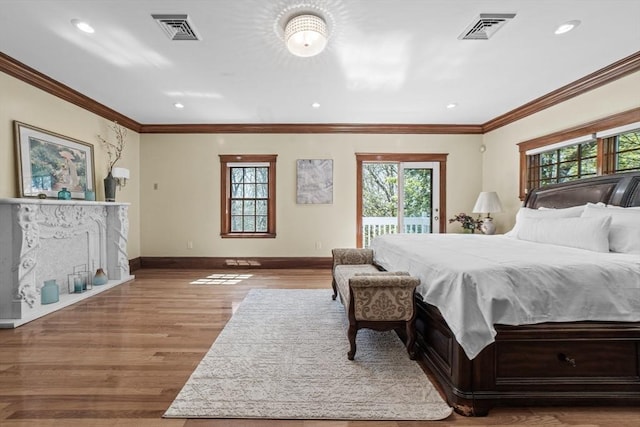 72 Charlemont St, Newton, MA 02461 - bedroom featuring multiple windows, access to exterior, baseboards, wood finished floors, and ornamental molding