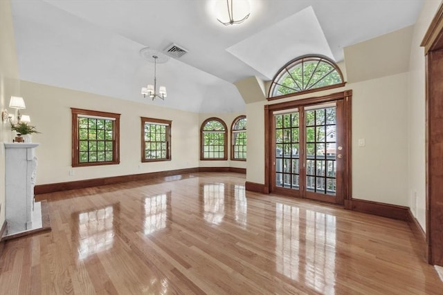 72 Charlemont St, Newton, MA 02461 - unfurnished living room featuring baseboards, light wood finished floors, and high vaulted ceiling
