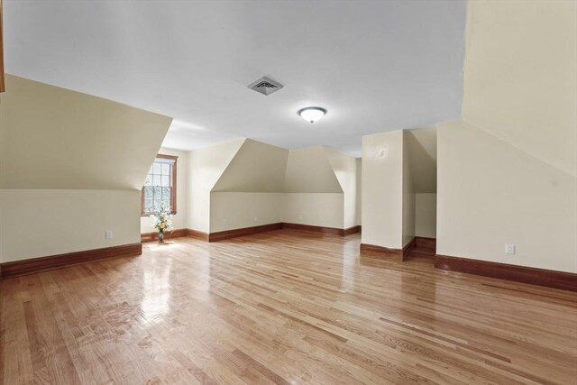 72 Charlemont St, Newton, MA 02461 - additional living space featuring vaulted ceiling, light wood-type flooring, and baseboards