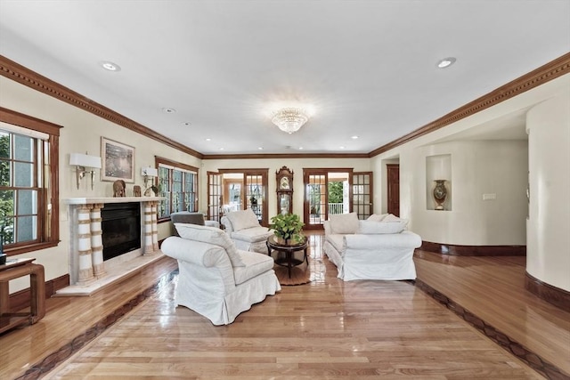 72 Charlemont St, Newton, MA 02461 - living area featuring light wood finished floors, a fireplace, baseboards, recessed lighting, and ornamental molding