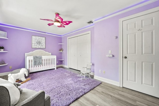 14 Weld St, Westborough, MA 01581 - bedroom featuring crown molding, wood finished floors, a closet, baseboards, and a ceiling fan