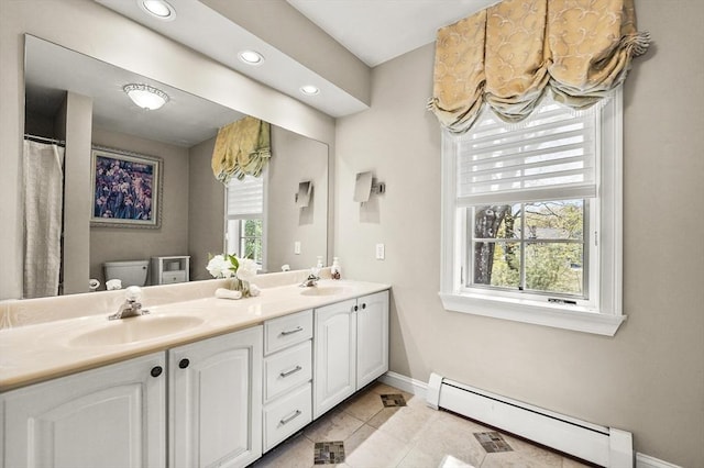 14 Weld St, Westborough, MA 01581 - bathroom featuring baseboard heating, baseboards, toilet, recessed lighting, and double vanity