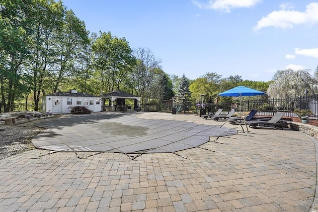 14 Weld St, Westborough, MA 01581 - view of patio featuring a gazebo, fence, a community pool, and an outdoor structure