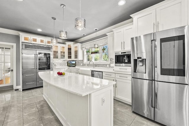 14 Weld St, Westborough, MA 01581 - kitchen featuring appliances with stainless steel finishes, recessed lighting, glass insert cabinets, a center island, and white cabinetry