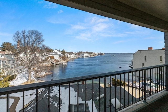 balcony featuring a water view