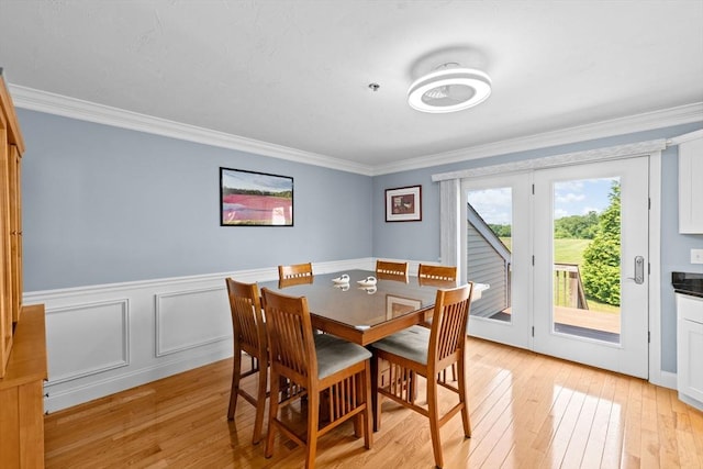 43 N Main St Unit B, Berkley, MA 02779 - dining space with light wood-type flooring, ornamental molding, and a wainscoted wall
