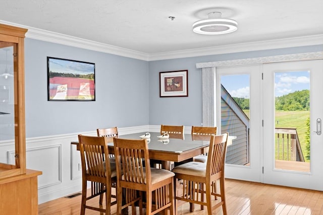 43 N Main St Unit B, Berkley, MA 02779 - dining space featuring light wood-type flooring, ornamental molding, and wainscoting