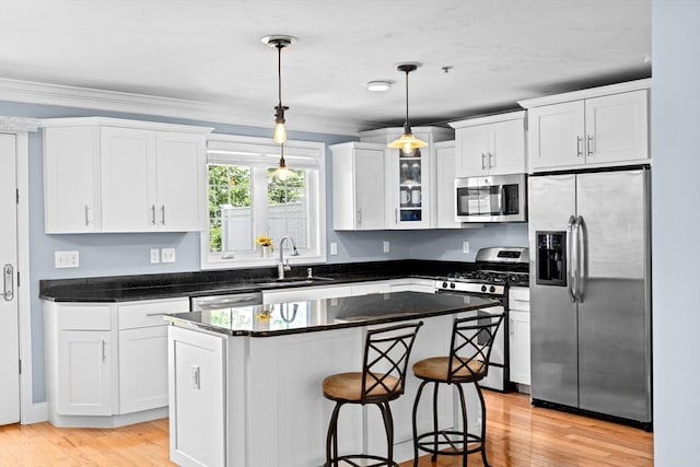 43 N Main St Unit B, Berkley, MA 02779 - kitchen featuring stainless steel appliances, white cabinetry, a center island, pendant lighting, and ornamental molding