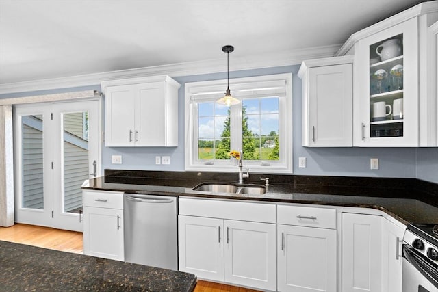 43 N Main St Unit B, Berkley, MA 02779 - kitchen featuring appliances with stainless steel finishes, white cabinets, dark stone counters, hanging light fixtures, and ornamental molding