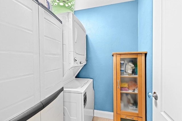 43 N Main St Unit B, Berkley, MA 02779 - laundry area featuring stacked washer / drying machine and baseboards