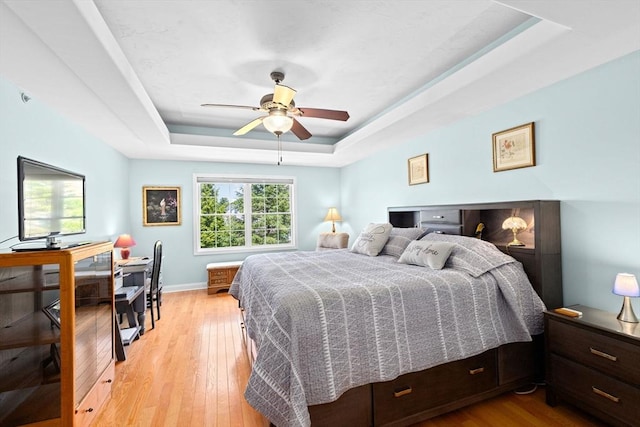 43 N Main St Unit B, Berkley, MA 02779 - bedroom with a tray ceiling, light wood-style flooring, and a ceiling fan