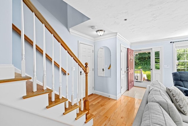 43 N Main St Unit B, Berkley, MA 02779 - entrance foyer featuring ornamental molding, stairs, and light wood finished floors