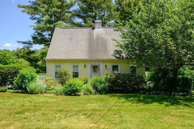 89 W Elm St, Pembroke, MA 02359 - cape cod house with a front yard and a chimney