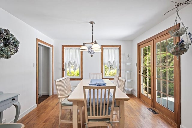 89 W Elm St, Pembroke, MA 02359 - dining area with a chandelier and light wood-style flooring