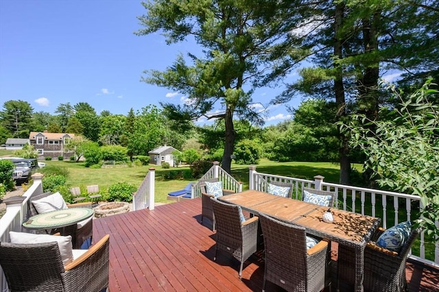 89 W Elm St, Pembroke, MA 02359 - wooden deck with outdoor dining area, a yard, and view of wooded area