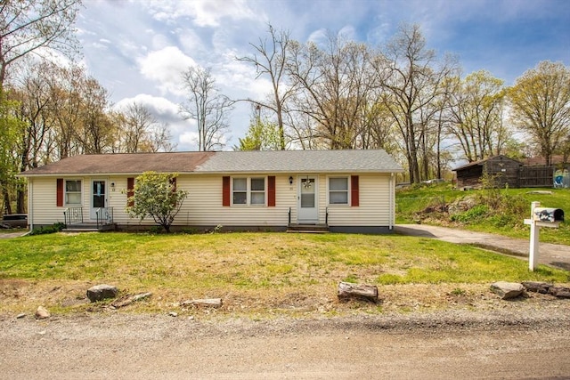 ranch-style house featuring a front lawn