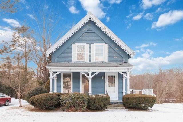 victorian house featuring a porch