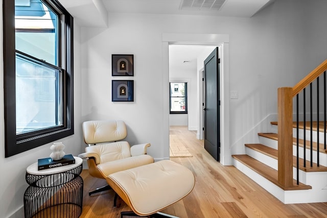 sitting room featuring light hardwood / wood-style flooring