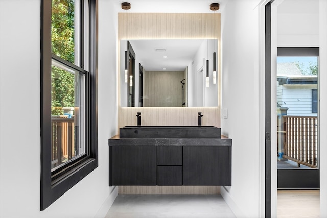 bathroom with vanity, hardwood / wood-style flooring, and plenty of natural light