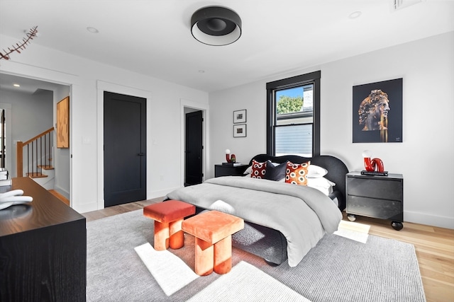 bedroom with light wood-type flooring