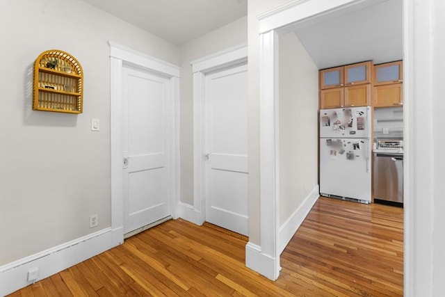 corridor with light wood-type flooring