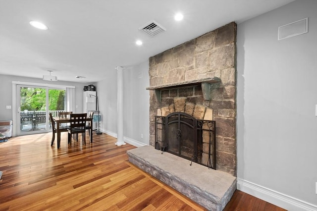 6 Birch Ln, Shrewsbury, MA 01545 - living area with wood finished floors, baseboards, a stone fireplace, and recessed lighting