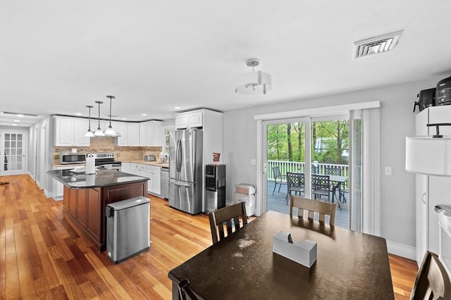 6 Birch Ln, Shrewsbury, MA 01545 - kitchen with stainless steel appliances, light wood-type flooring, white cabinetry, recessed lighting, and decorative backsplash