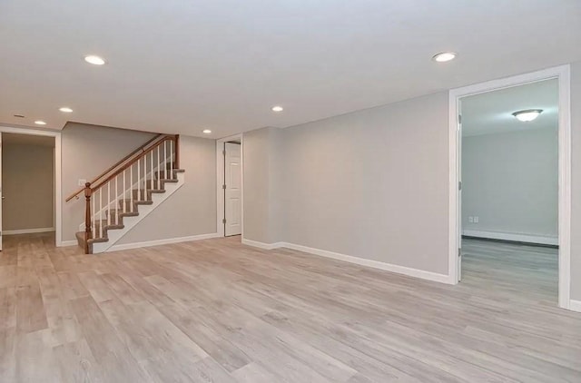 6 Birch Ln, Shrewsbury, MA 01545 - unfurnished living room featuring stairway, light wood-style flooring, baseboards, recessed lighting, and a baseboard radiator