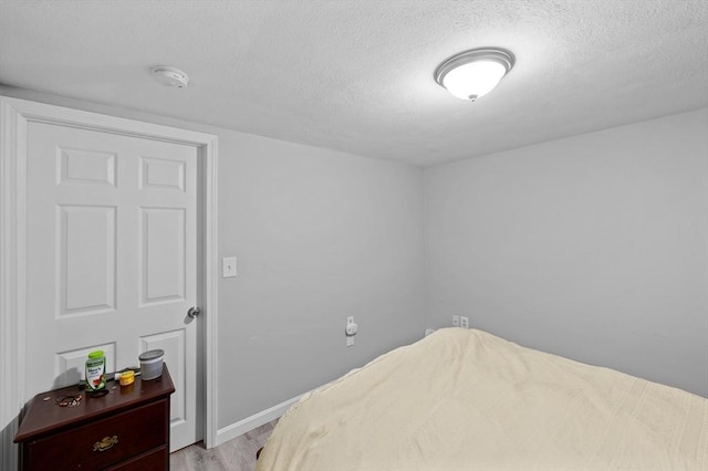 6 Birch Ln, Shrewsbury, MA 01545 - bedroom featuring a textured ceiling, light wood-type flooring, and baseboards