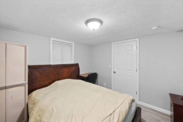 6 Birch Ln, Shrewsbury, MA 01545 - bedroom with wood finished floors, a textured ceiling, and baseboards