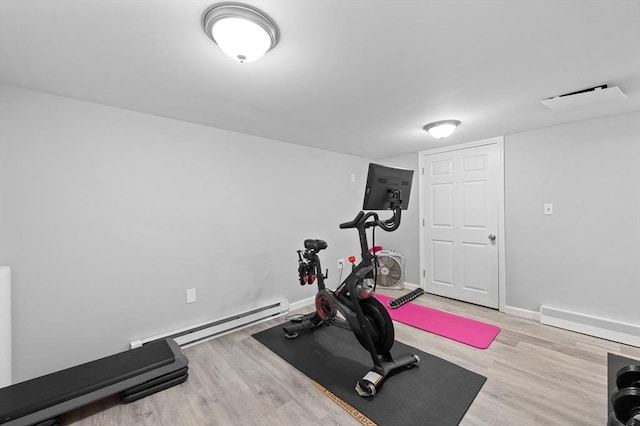 6 Birch Ln, Shrewsbury, MA 01545 - exercise room featuring wood finished floors, a baseboard radiator, and baseboards