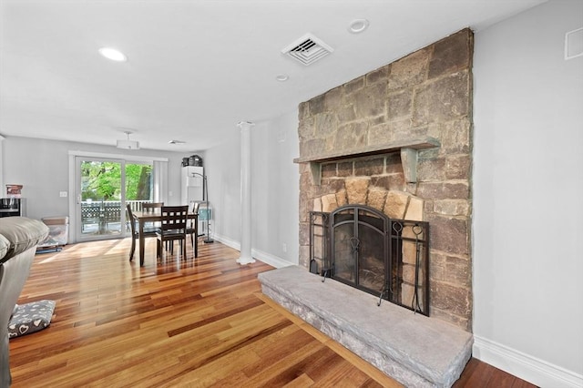 6 Birch Ln, Shrewsbury, MA 01545 - living area with wood finished floors, a stone fireplace, baseboards, and recessed lighting