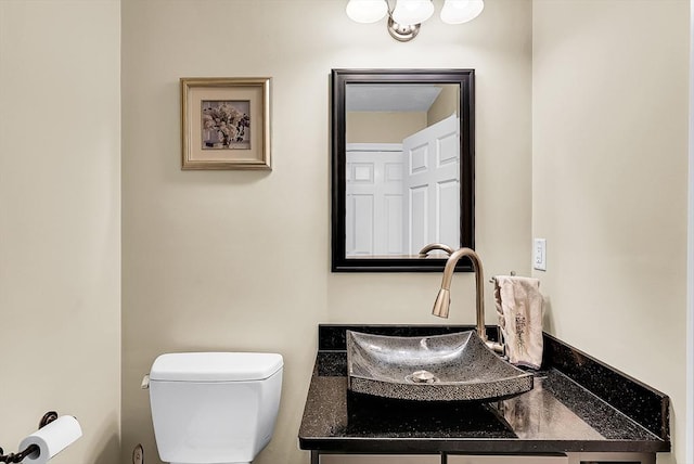 half bath with vanity and toilet