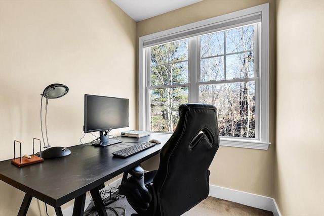 carpeted office featuring a wealth of natural light and baseboards