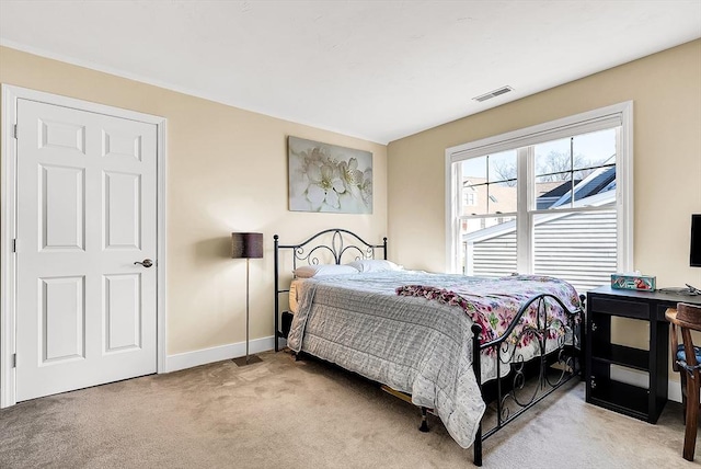 bedroom featuring light carpet, baseboards, and visible vents