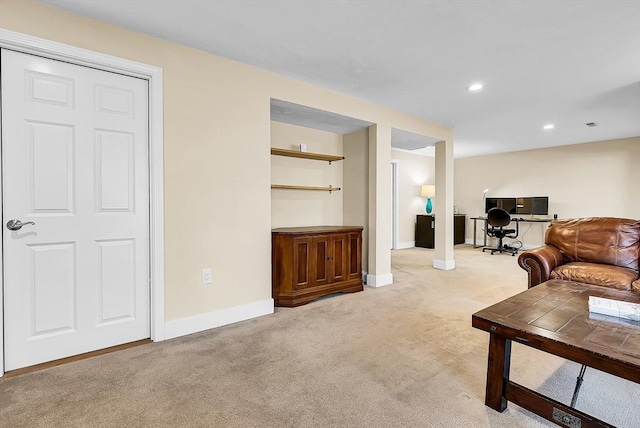 living room featuring light carpet, baseboards, and recessed lighting