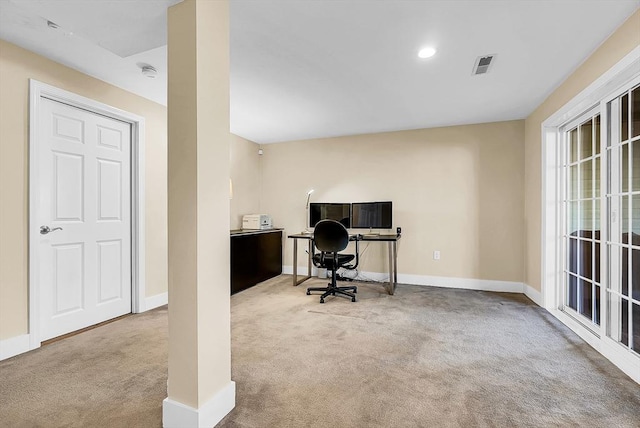 carpeted home office with visible vents and baseboards