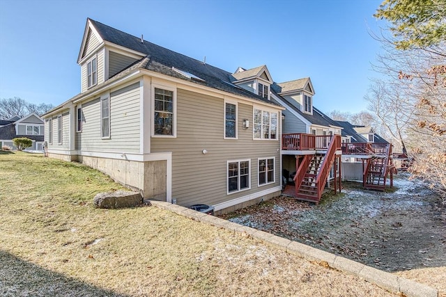 back of house with stairs, a lawn, and a wooden deck