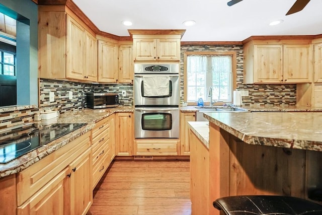 252 Howe St, East Brookfield, MA 01515 - kitchen featuring appliances with stainless steel finishes, light brown cabinets, ceiling fan, backsplash, and recessed lighting