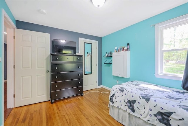 252 Howe St, East Brookfield, MA 01515 - bedroom featuring multiple windows, light wood-style floors, and baseboards