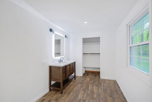 252 Howe St, East Brookfield, MA 01515 - corridor featuring dark wood-style floors, a sink, and baseboards