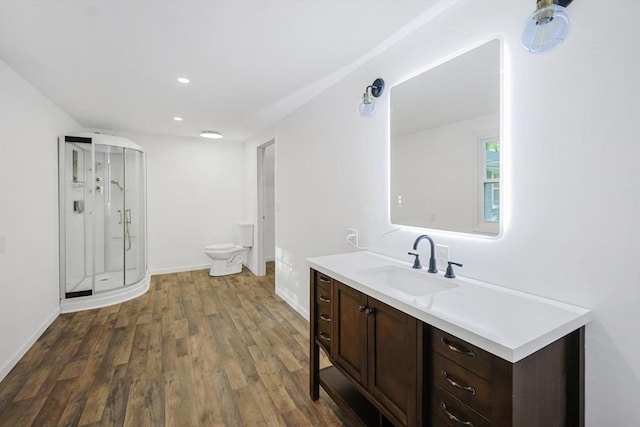252 Howe St, East Brookfield, MA 01515 - bathroom featuring vanity, wood finished floors, a shower stall, toilet, and recessed lighting