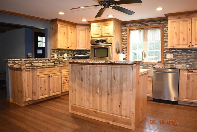 252 Howe St, East Brookfield, MA 01515 - kitchen featuring stainless steel appliances, light brown cabinets, a kitchen island, backsplash, and recessed lighting