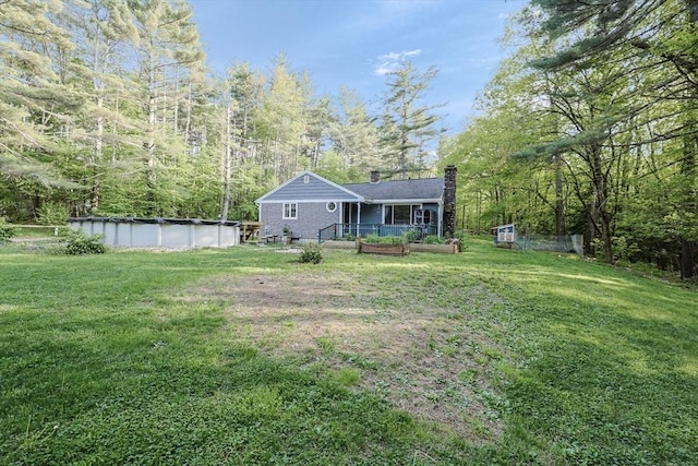 252 Howe St, East Brookfield, MA 01515 - view of grassy yard with a covered pool