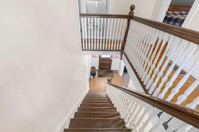 staircase featuring baseboards