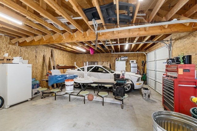 garage with freestanding refrigerator