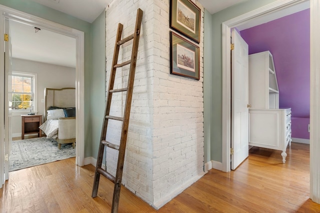 hall with light hardwood / wood-style floors