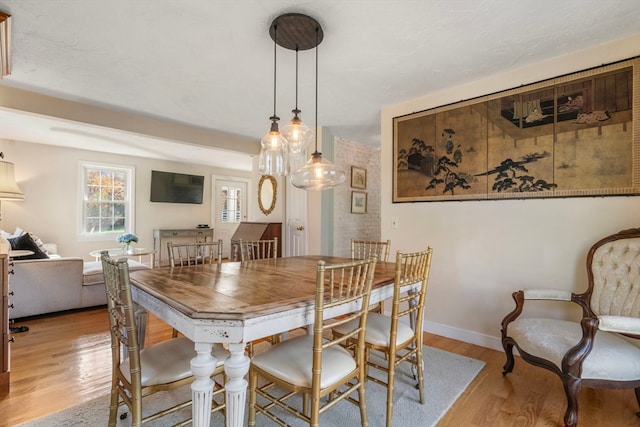 dining room with light wood-type flooring