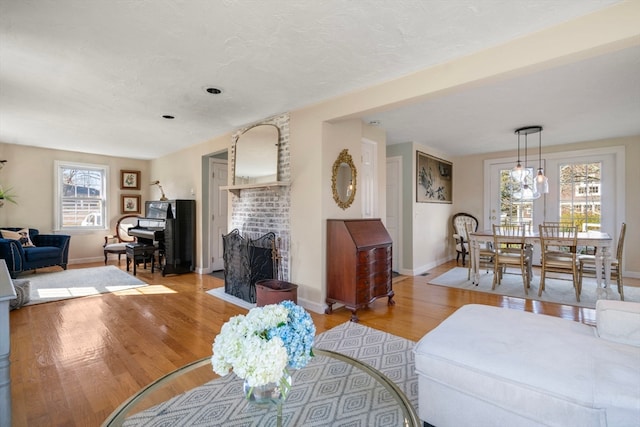 living room featuring light hardwood / wood-style flooring and a fireplace