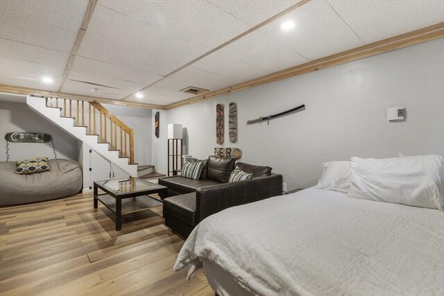 bedroom with visible vents, light wood-type flooring, and recessed lighting